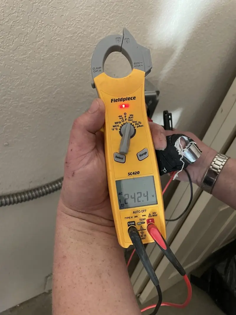 Voltage testing with clamp meter during Aluminum Wiring Replacement in New Freedom
